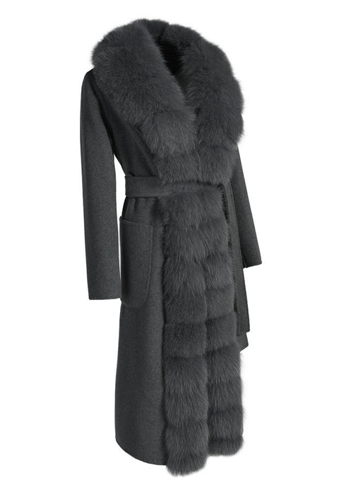 Elegant grey double-faced cashmere coat with a refined silhouette, cinched waist belt, and soft genuine grey fox fur trim for added warmth and sophistication.