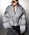 Chic model showcasing a Cropped Silver Fox Fur Coat with sunglasses and stylish accessories.