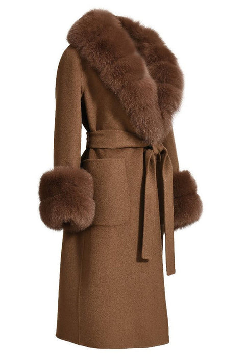 The brown cashmere coat with fox fur accents brings a touch of luxury and warmth, ideal for elevating any winter outfit.